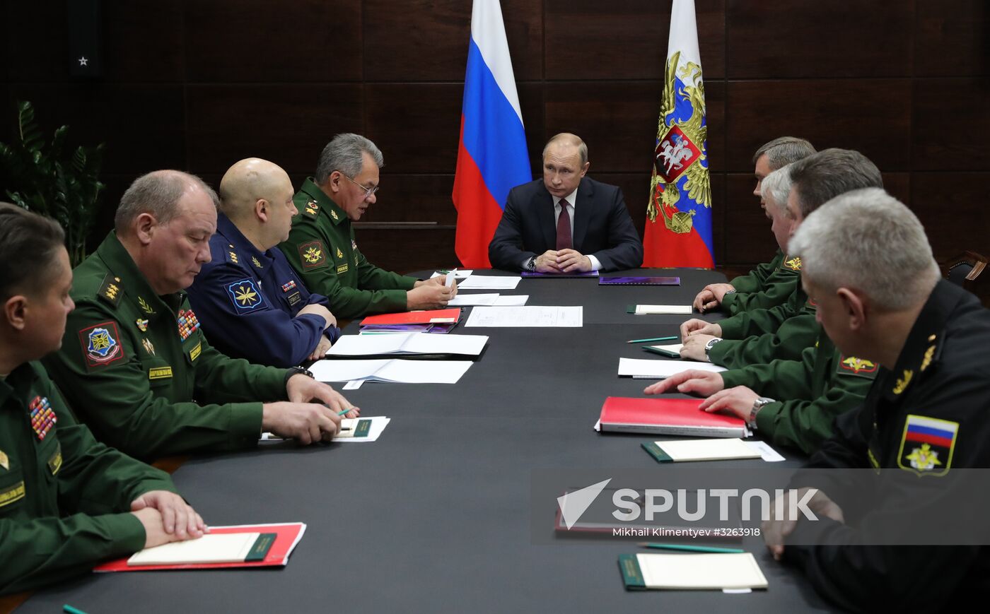 Russian President Vladimir Putin meets with military district troops commanders and Northern Fleet