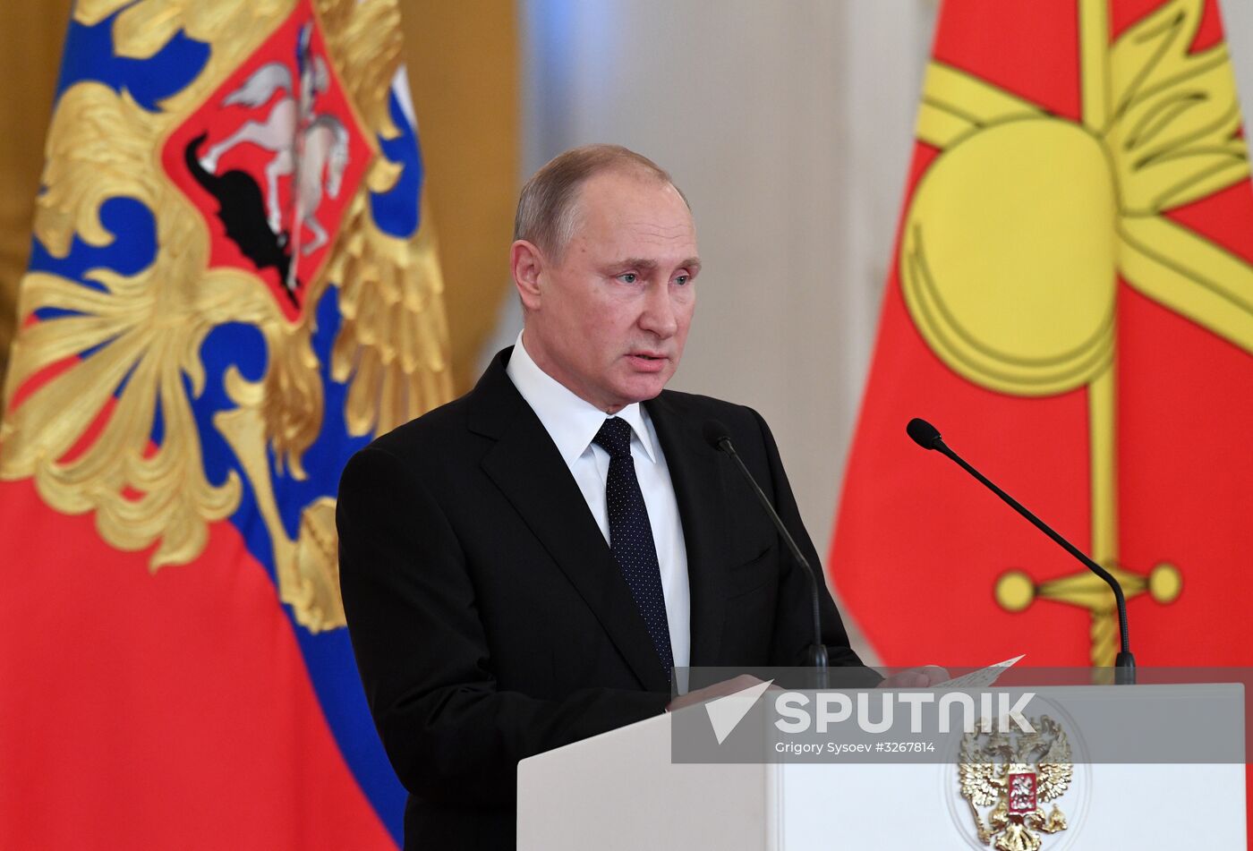 Russian President Vladimir Putin meets with service personnel who took part in counter-terrorism operation in Syria
