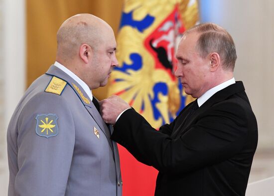 Russian President Vladimir Putin meets with service personnel who took part in counter-terrorism operation in Syria