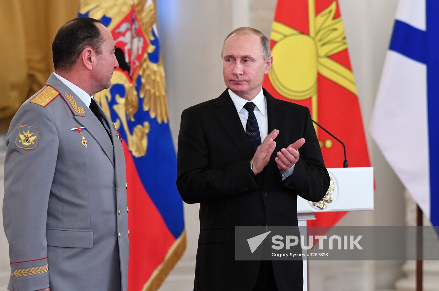 Russian President Vladimir Putin meets with service personnel who took part in counter-terrorism operation in Syria