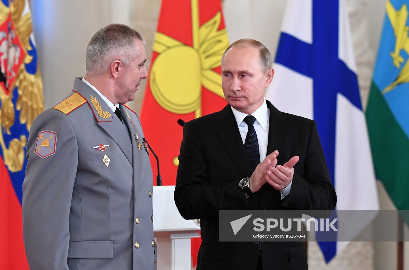 Russian President Vladimir Putin meets with service personnel who took part in counter-terrorism operation in Syria