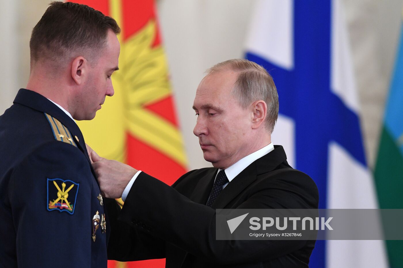 Russian President Vladimir Putin meets with service personnel who took part in counter-terrorism operation in Syria