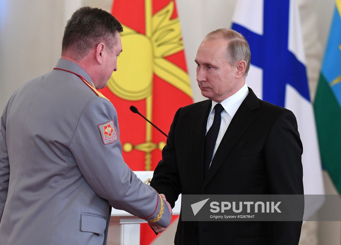 Russian President Vladimir Putin meets with service personnel who took part in counter-terrorism operation in Syria