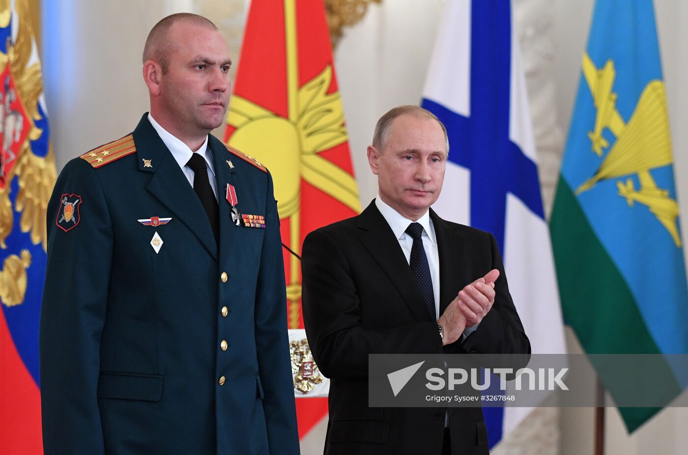 Russian President Vladimir Putin meets with service personnel who took part in counter-terrorism operation in Syria