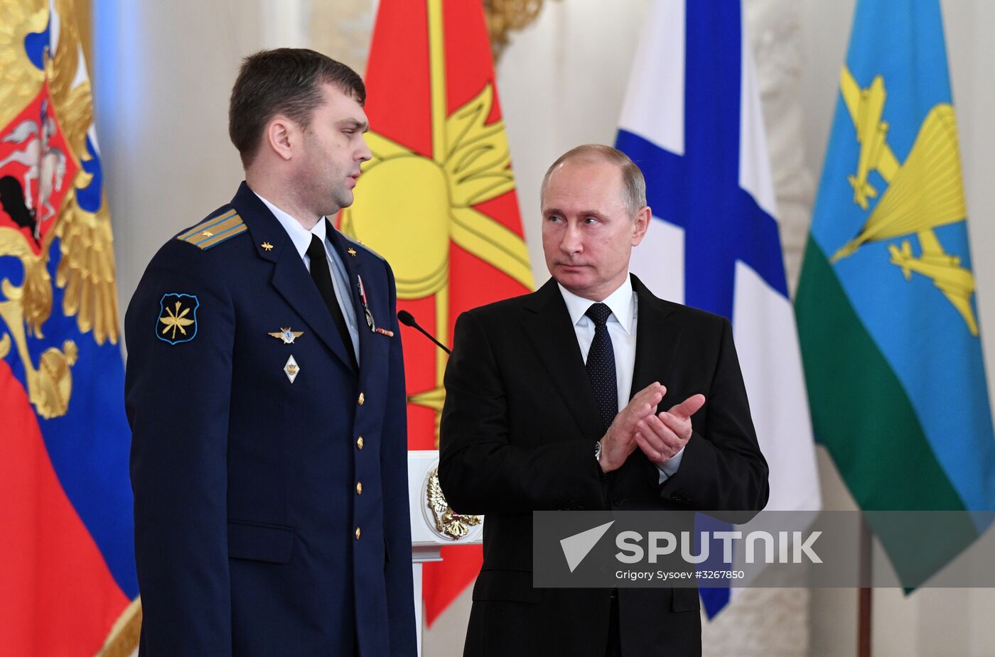 Russian President Vladimir Putin meets with service personnel who took part in counter-terrorism operation in Syria