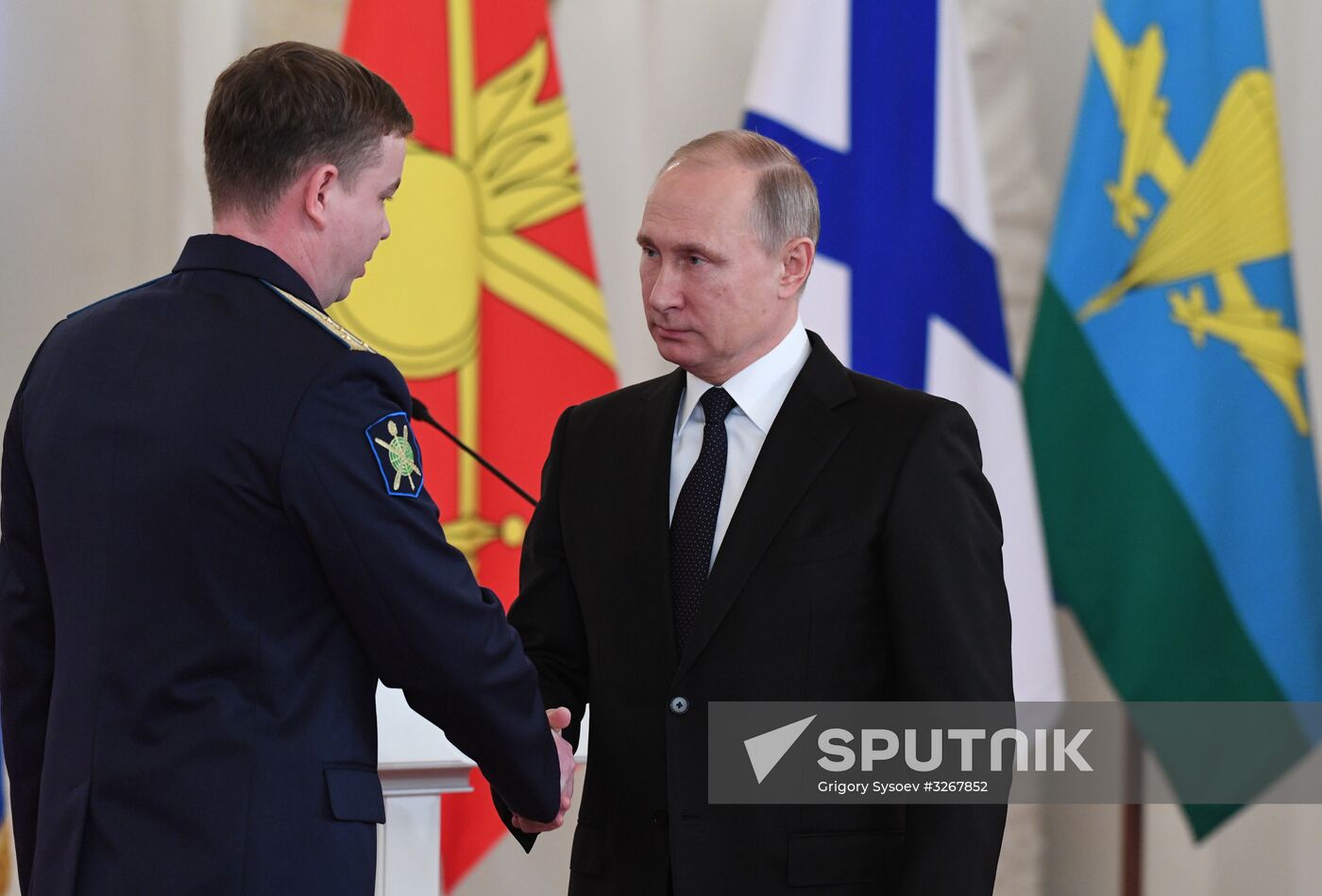 Russian President Vladimir Putin meets with service personnel who took part in counter-terrorism operation in Syria