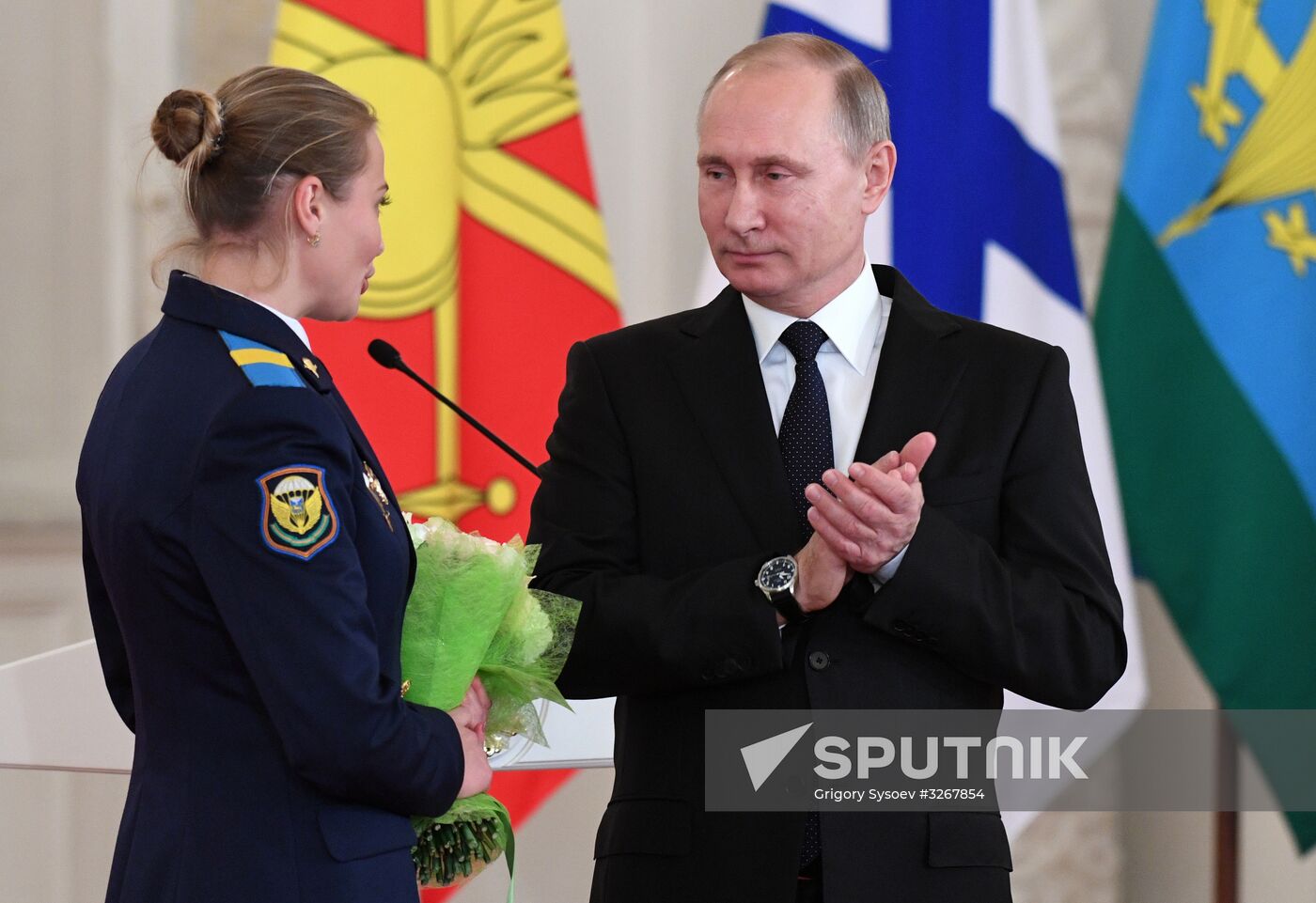 Russian President Vladimir Putin meets with service personnel who took part in counter-terrorism operation in Syria