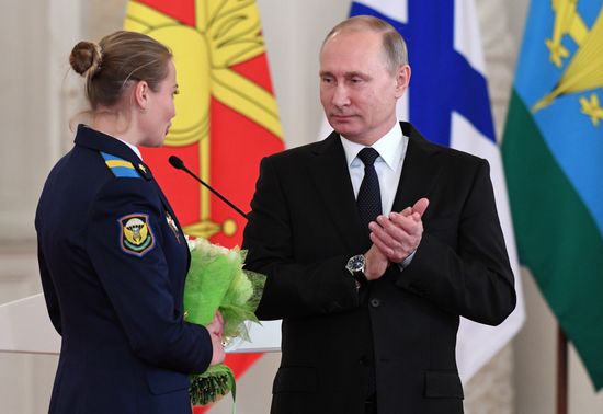 Russian President Vladimir Putin meets with service personnel who took part in counter-terrorism operation in Syria