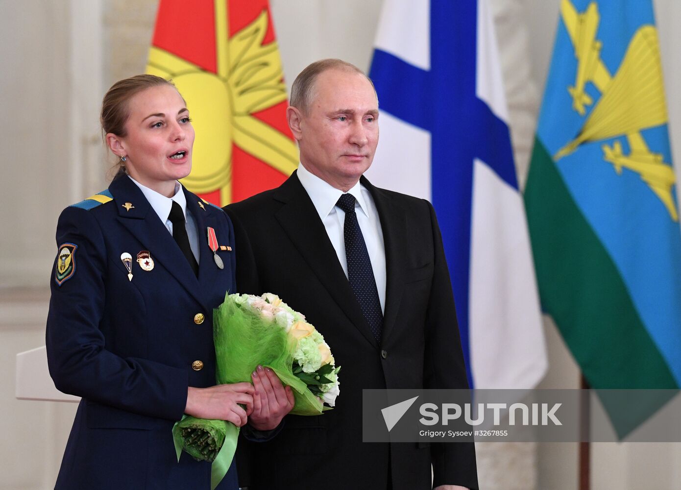 Russian President Vladimir Putin meets with service personnel who took part in counter-terrorism operation in Syria