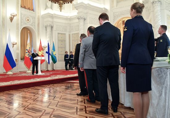 Russian President Vladimir Putin meets with service personnel who took part in counter-terrorism operation in Syria