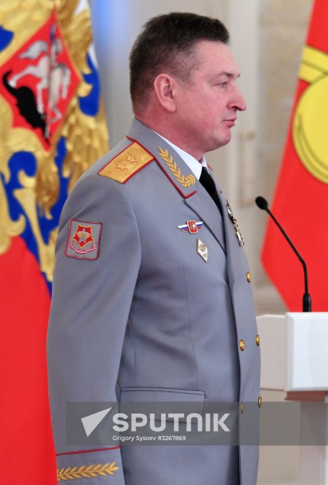 Russian President Vladimir Putin meets with service personnel who took part in counter-terrorism operation in Syria