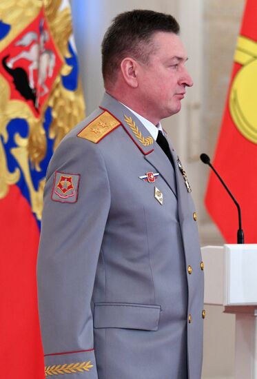 Russian President Vladimir Putin meets with service personnel who took part in counter-terrorism operation in Syria