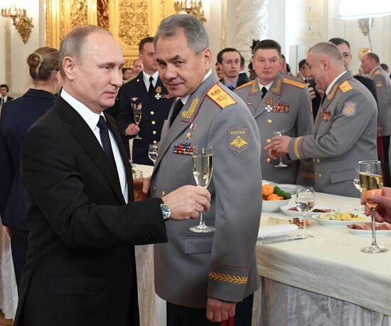 Russian President Vladimir Putin meets with service personnel who took part in counter-terrorism operation in Syria