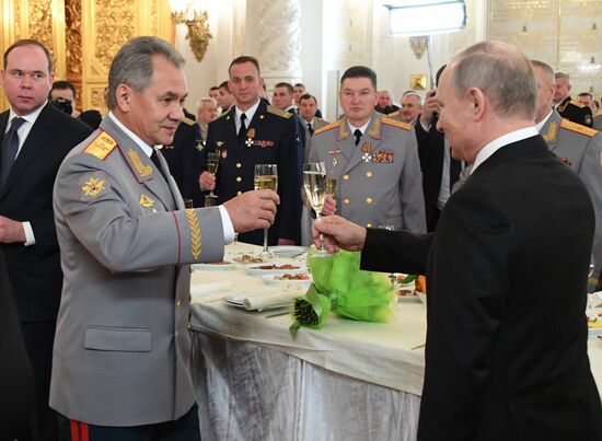 Russian President Vladimir Putin meets with service personnel who took part in counter-terrorism operation in Syria