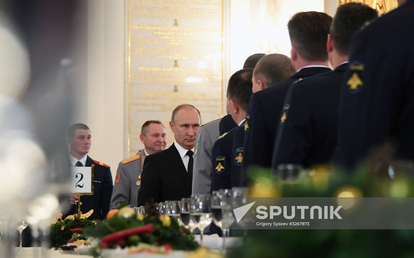 Russian President Vladimir Putin meets with service personnel who took part in counter-terrorism operation in Syria