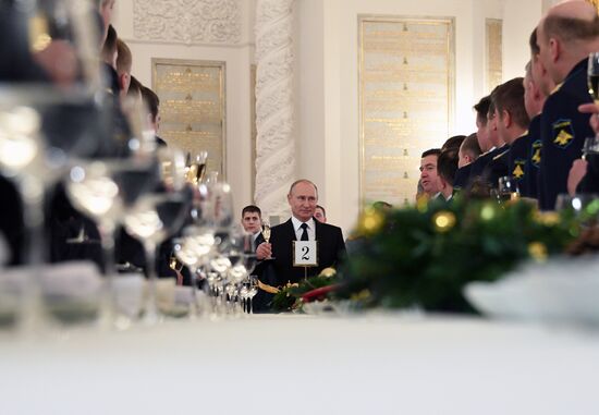 Russian President Vladimir Putin meets with service personnel who took part in counter-terrorism operation in Syria