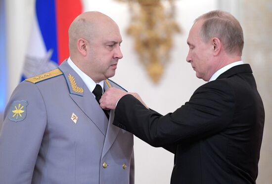 Russian President Vladimir Putin meets with service personnel who took part in counter-terrorism operation in Syria