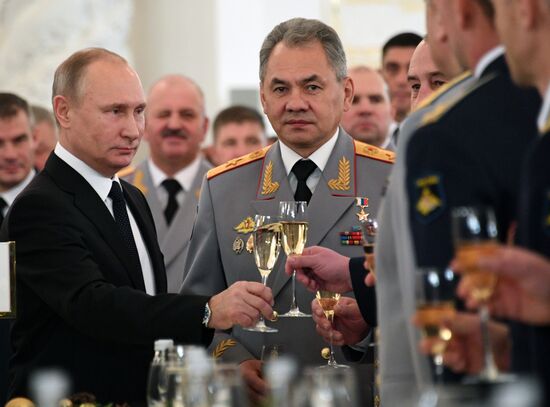 Russian President Vladimir Putin meets with service personnel who took part in counter-terrorism operation in Syria