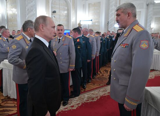 Russian President Vladimir Putin meets with service personnel who took part in counter-terrorism operation in Syria