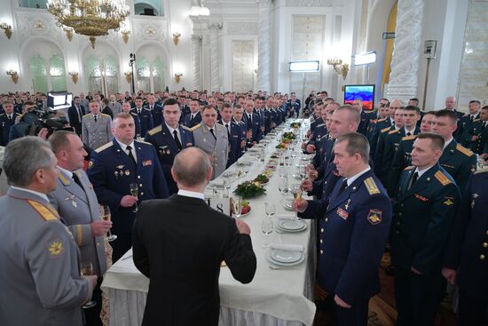 Russian President Vladimir Putin meets with service personnel who took part in counter-terrorism operation in Syria