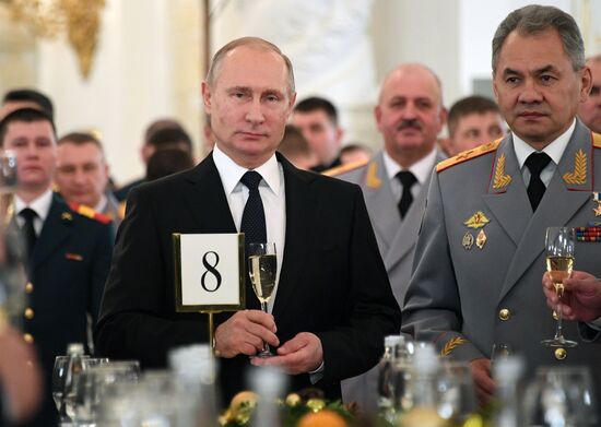 Russian President Vladimir Putin meets with service personnel who took part in counter-terrorism operation in Syria