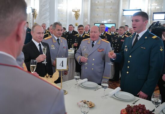 Russian President Vladimir Putin meets with service personnel who took part in counter-terrorism operation in Syria
