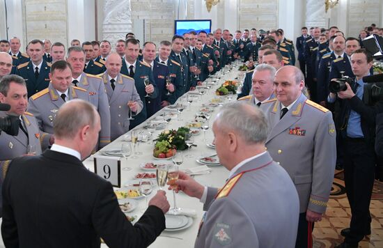 Russian President Vladimir Putin meets with service personnel who took part in counter-terrorism operation in Syria