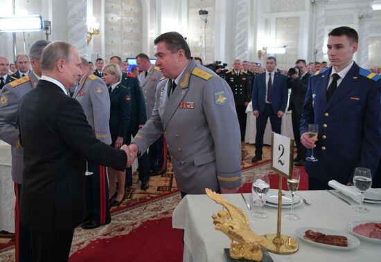 Russian President Vladimir Putin meets with service personnel who took part in counter-terrorism operation in Syria