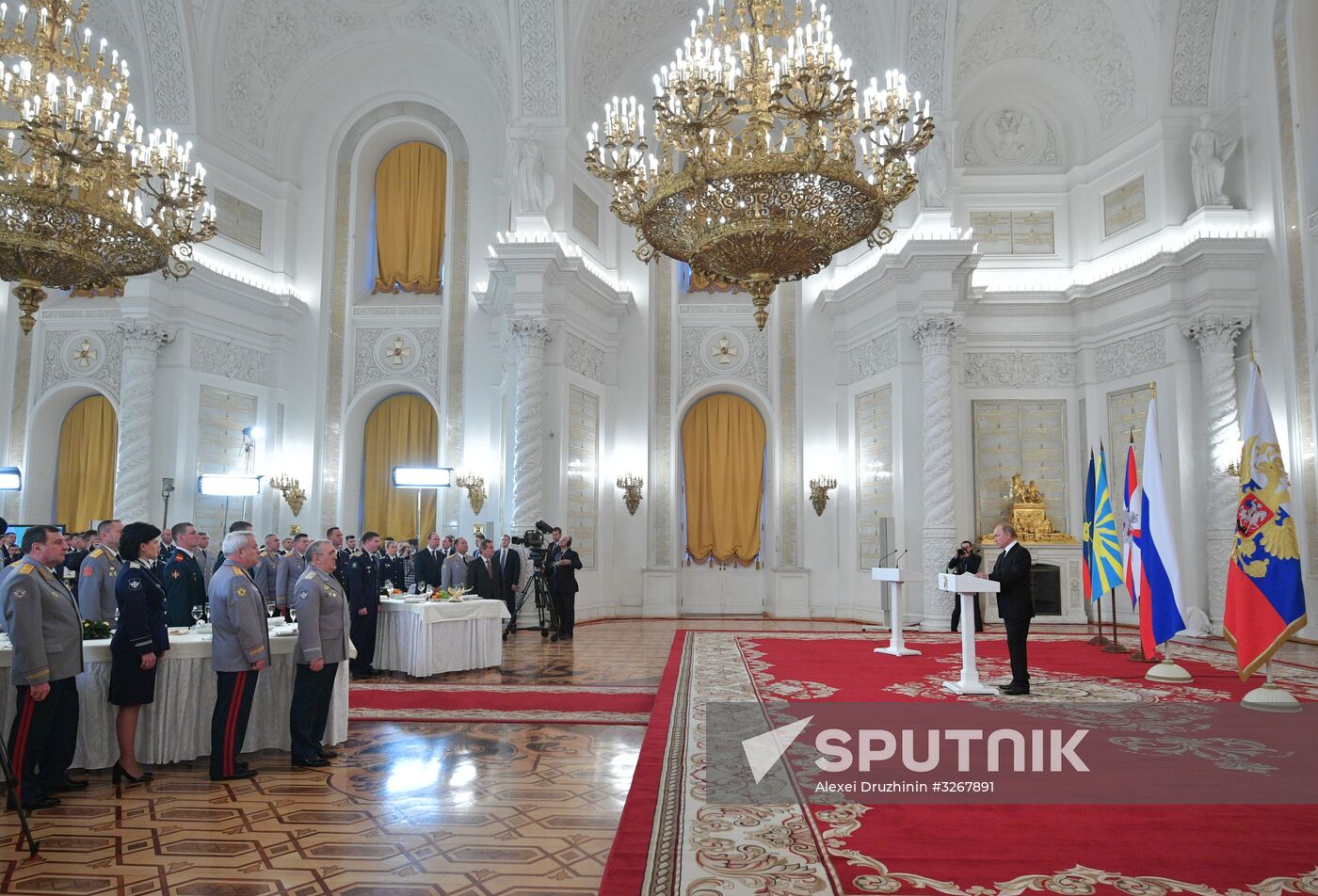 Russian President Vladimir Putin meets with service personnel who took part in counter-terrorism operation in Syria