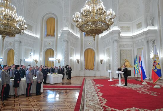 Russian President Vladimir Putin meets with service personnel who took part in counter-terrorism operation in Syria