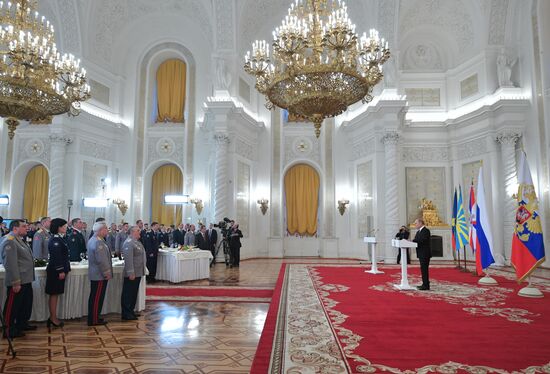 Russian President Vladimir Putin meets with service personnel who took part in counter-terrorism operation in Syria