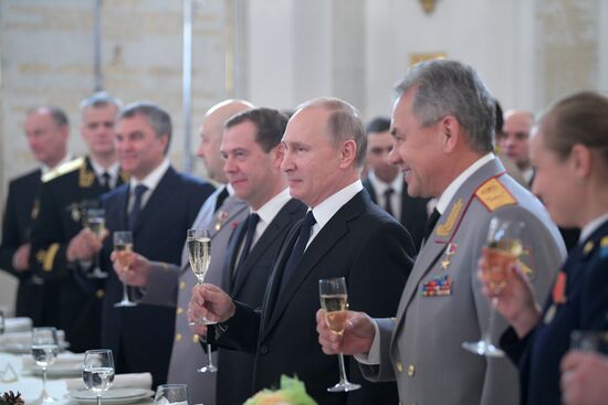 Russian President Vladimir Putin meets with service personnel who took part in counter-terrorism operation in Syria