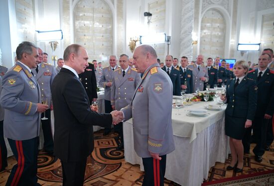 Russian President Vladimir Putin meets with service personnel who took part in counter-terrorism operation in Syria