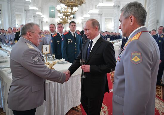 Russian President Vladimir Putin meets with service personnel who took part in counter-terrorism operation in Syria