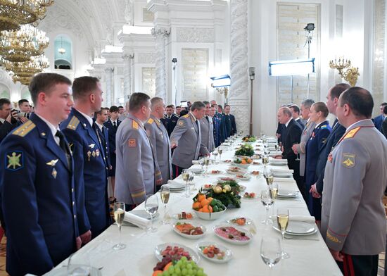 Russian President Vladimir Putin meets with service personnel who took part in counter-terrorism operation in Syria