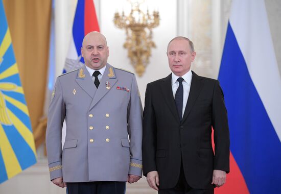 Russian President Vladimir Putin meets with service personnel who took part in counter-terrorism operation in Syria