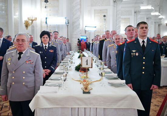 Russian President Vladimir Putin meets with service personnel who took part in counter-terrorism operation in Syria