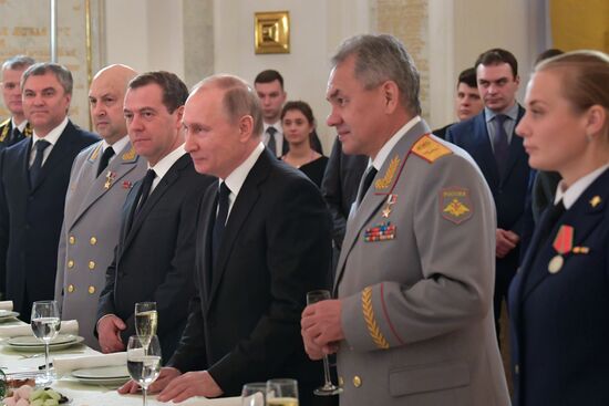 Russian President Vladimir Putin meets with service personnel who took part in counter-terrorism operation in Syria