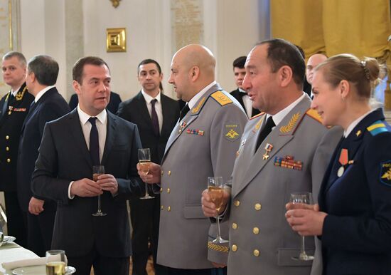 Russian President Vladimir Putin meets with service personnel who took part in counter-terrorism operation in Syria