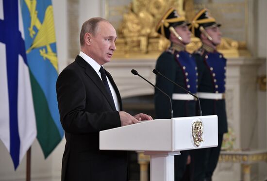 Russian President Vladimir Putin meets with service personnel who took part in counter-terrorism operation in Syria