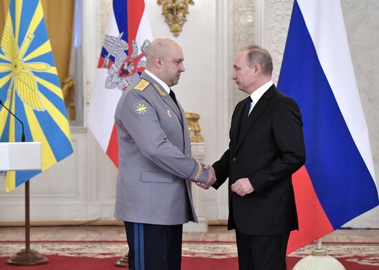 Russian President Vladimir Putin meets with service personnel who took part in counter-terrorism operation in Syria