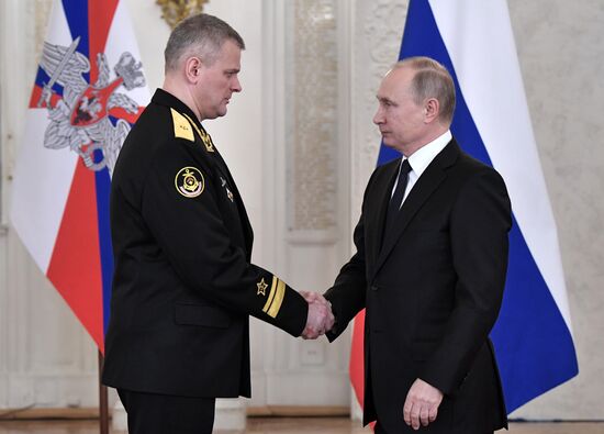 Russian President Vladimir Putin meets with service personnel who took part in counter-terrorism operation in Syria