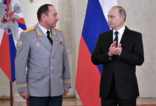 Russian President Vladimir Putin meets with service personnel who took part in counter-terrorism operation in Syria