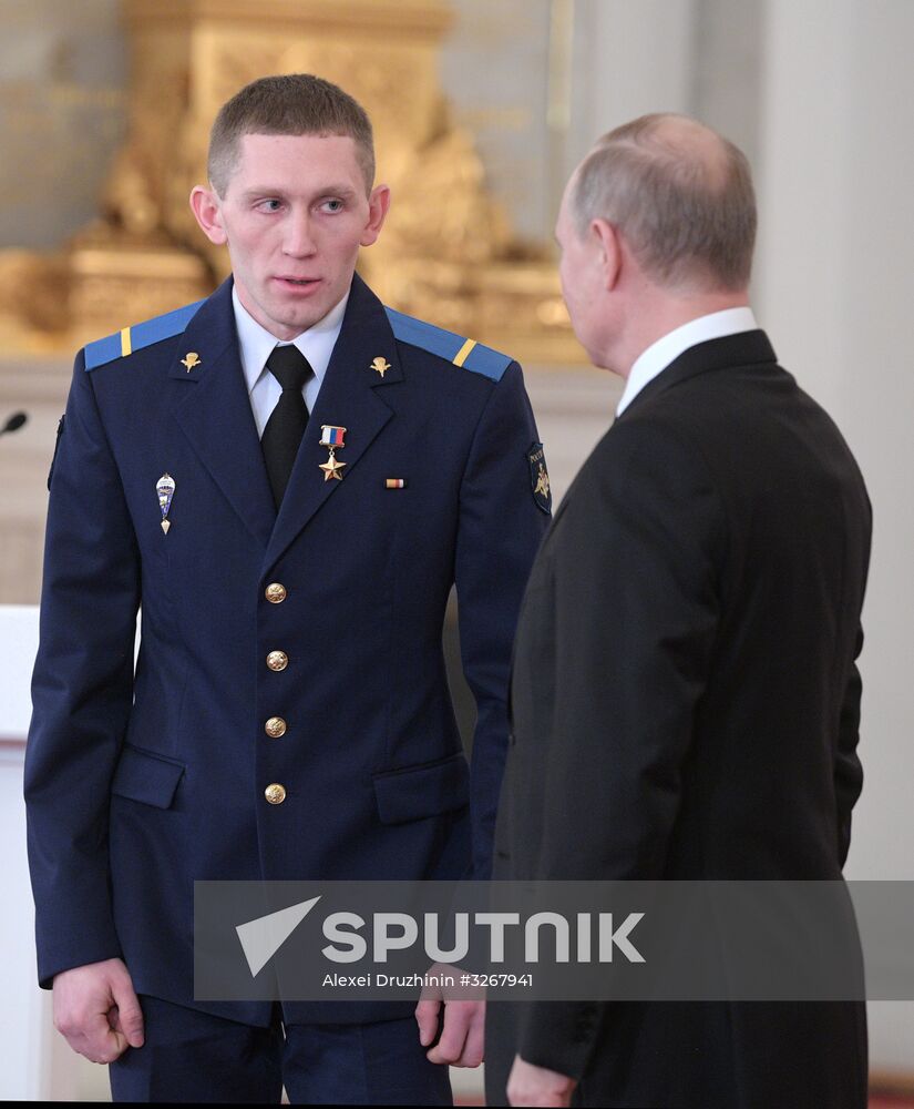 Russian President Vladimir Putin meets with service personnel who took part in counter-terrorism operation in Syria
