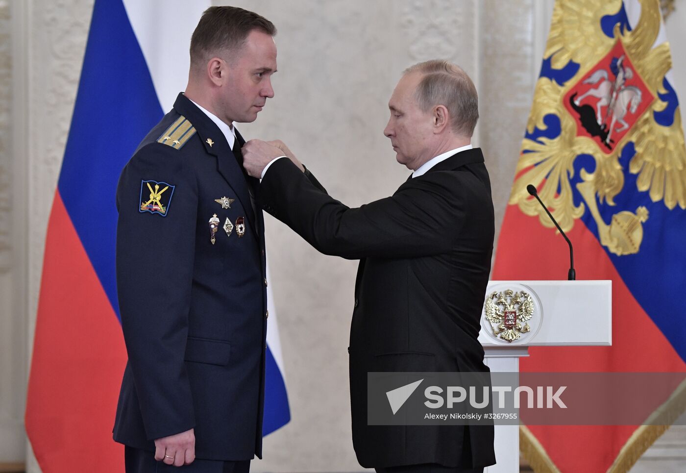 Russian President Vladimir Putin meets with service personnel who took part in counter-terrorism operation in Syria