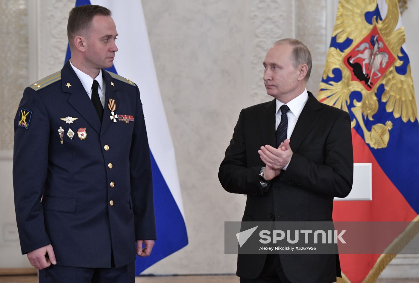 Russian President Vladimir Putin meets with service personnel who took part in counter-terrorism operation in Syria