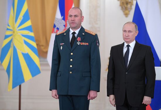 Russian President Vladimir Putin meets with service personnel who took part in counter-terrorism operation in Syria