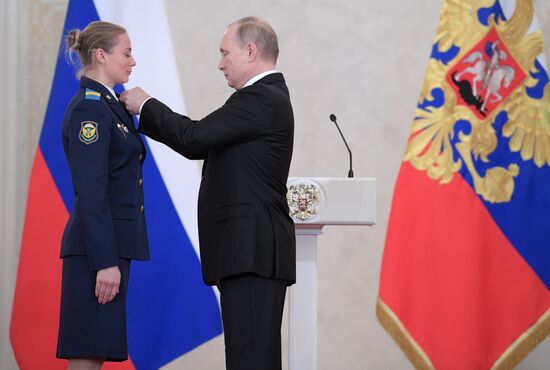 Russian President Vladimir Putin meets with service personnel who took part in counter-terrorism operation in Syria
