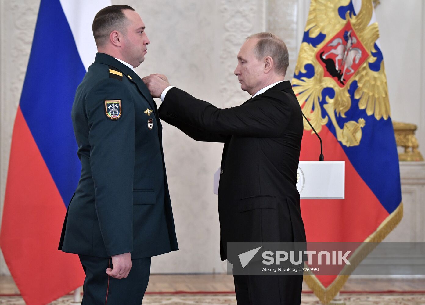 Russian President Vladimir Putin meets with service personnel who took part in counter-terrorism operation in Syria