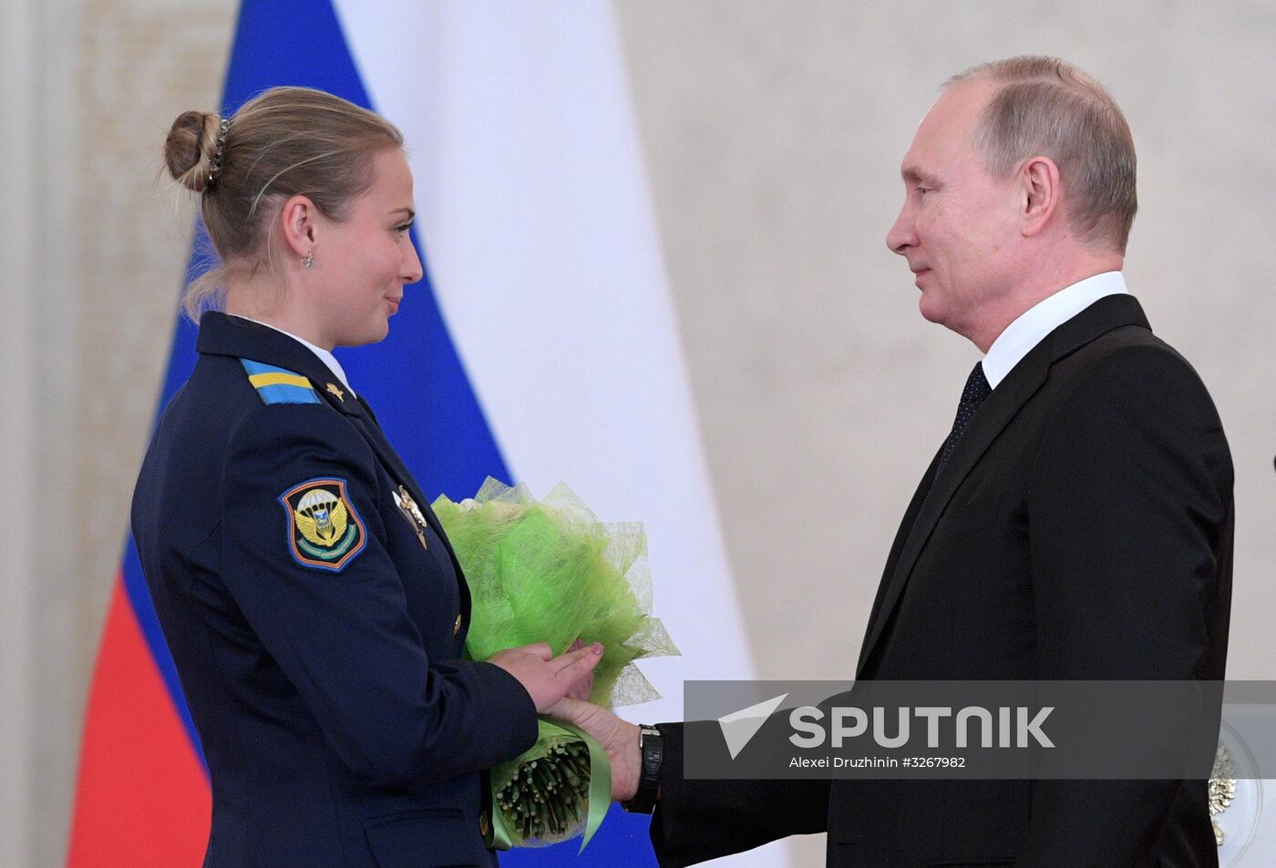 Russian President Vladimir Putin meets with service personnel who took part in counter-terrorism operation in Syria